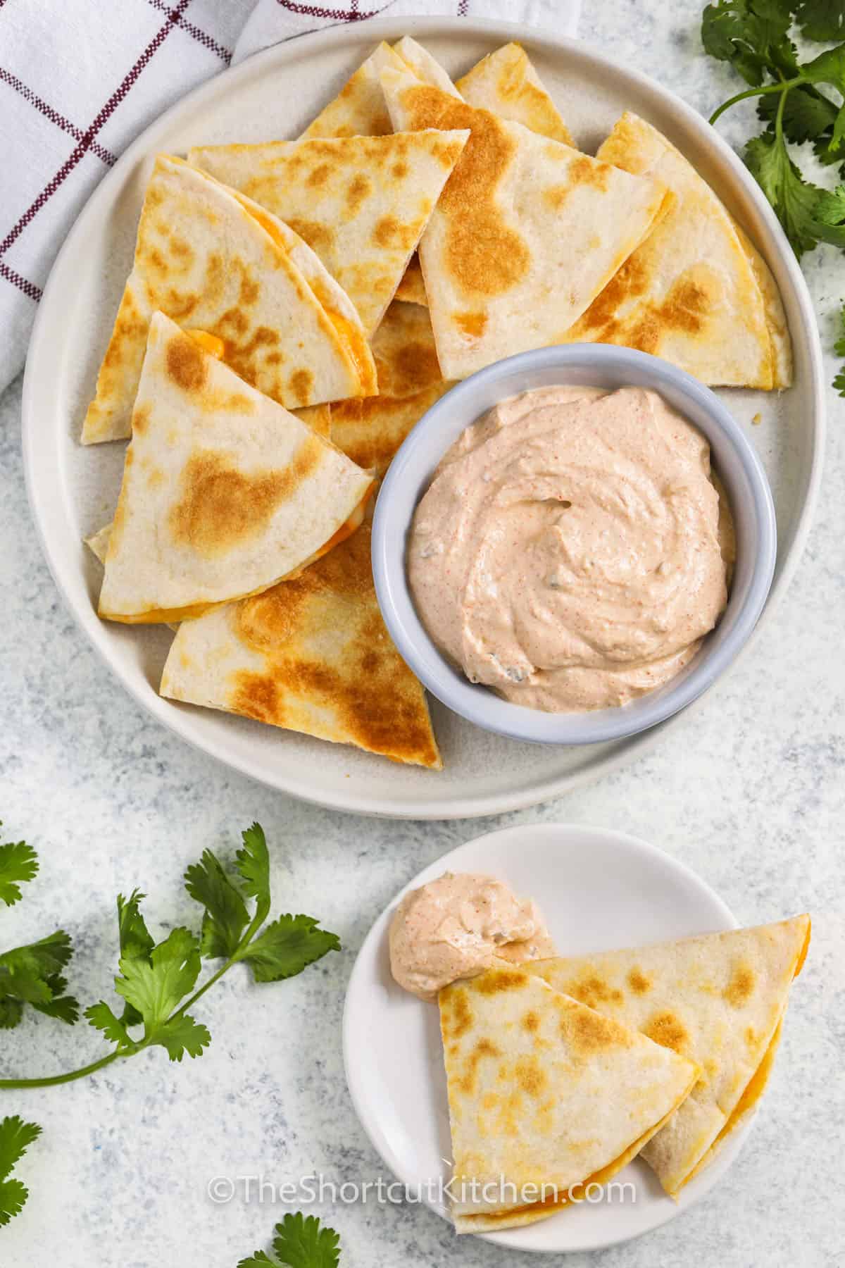plate of quesadillas with Copycat Taco Bell Quesadilla Sauce
