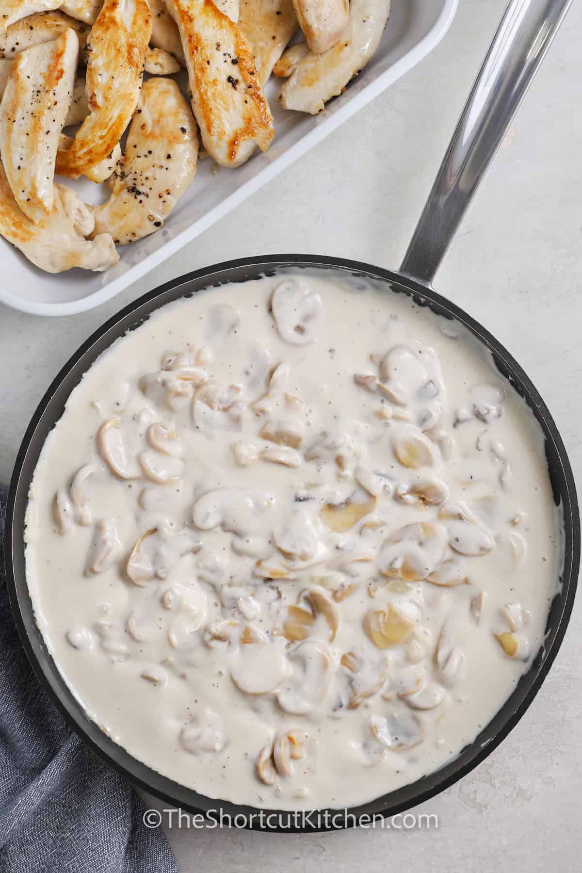 sauce in a pan to make Creamy Chicken Mushroom Casserole