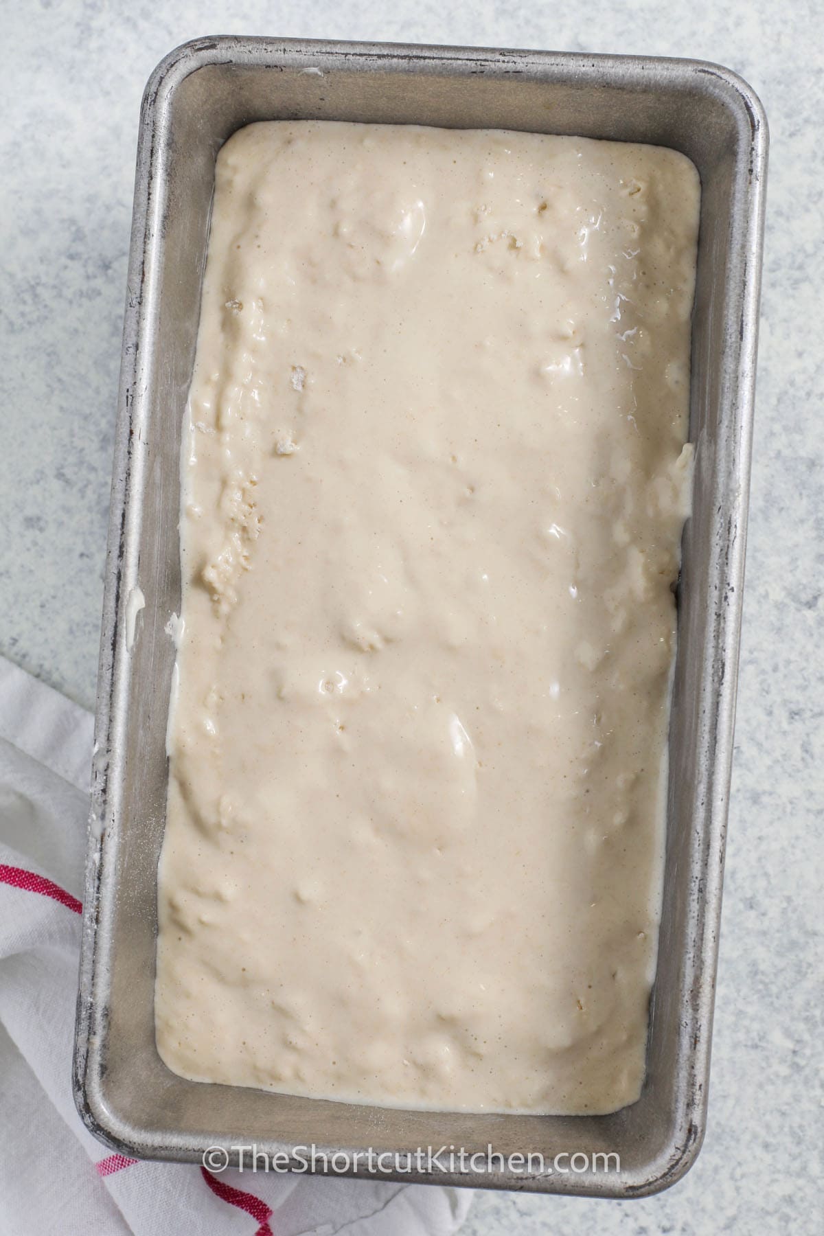 adding Ice Cream Bread Recipe batter to pan