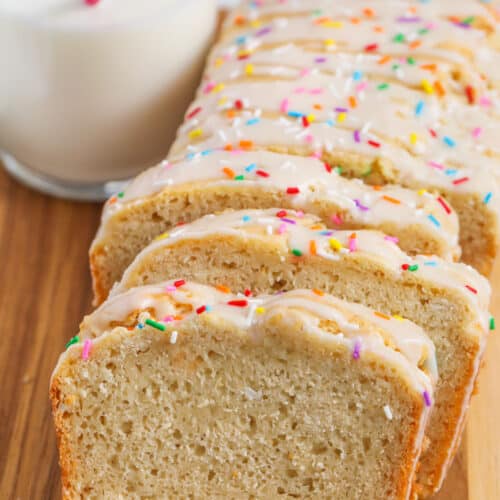 loaf of Ice Cream Bread Recipe cut into slices with glass of milk