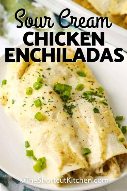 Two sour cream chicken enchiladas on a plate with a title