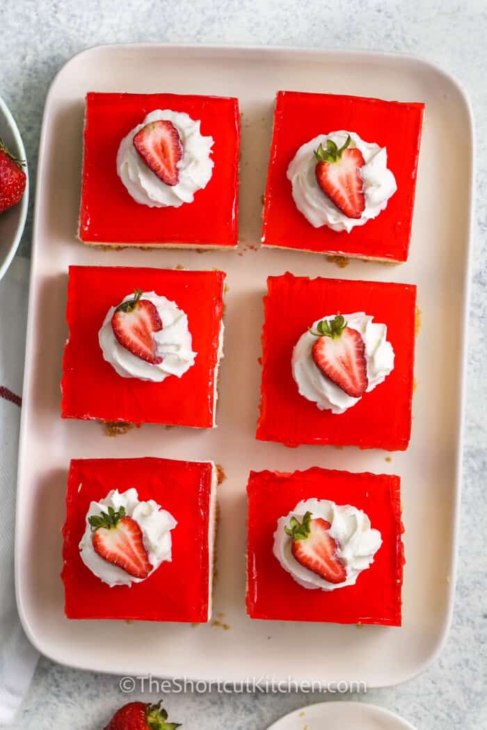 No Bake Strawberry Cheesecake Bars on a plate