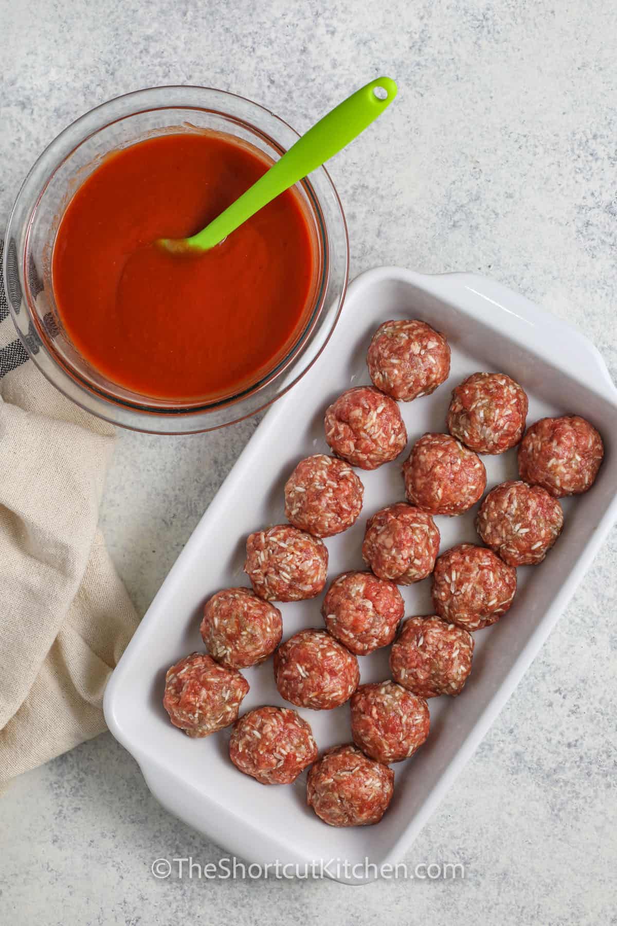 meatballs in a dish with tomato sauce in a bowl