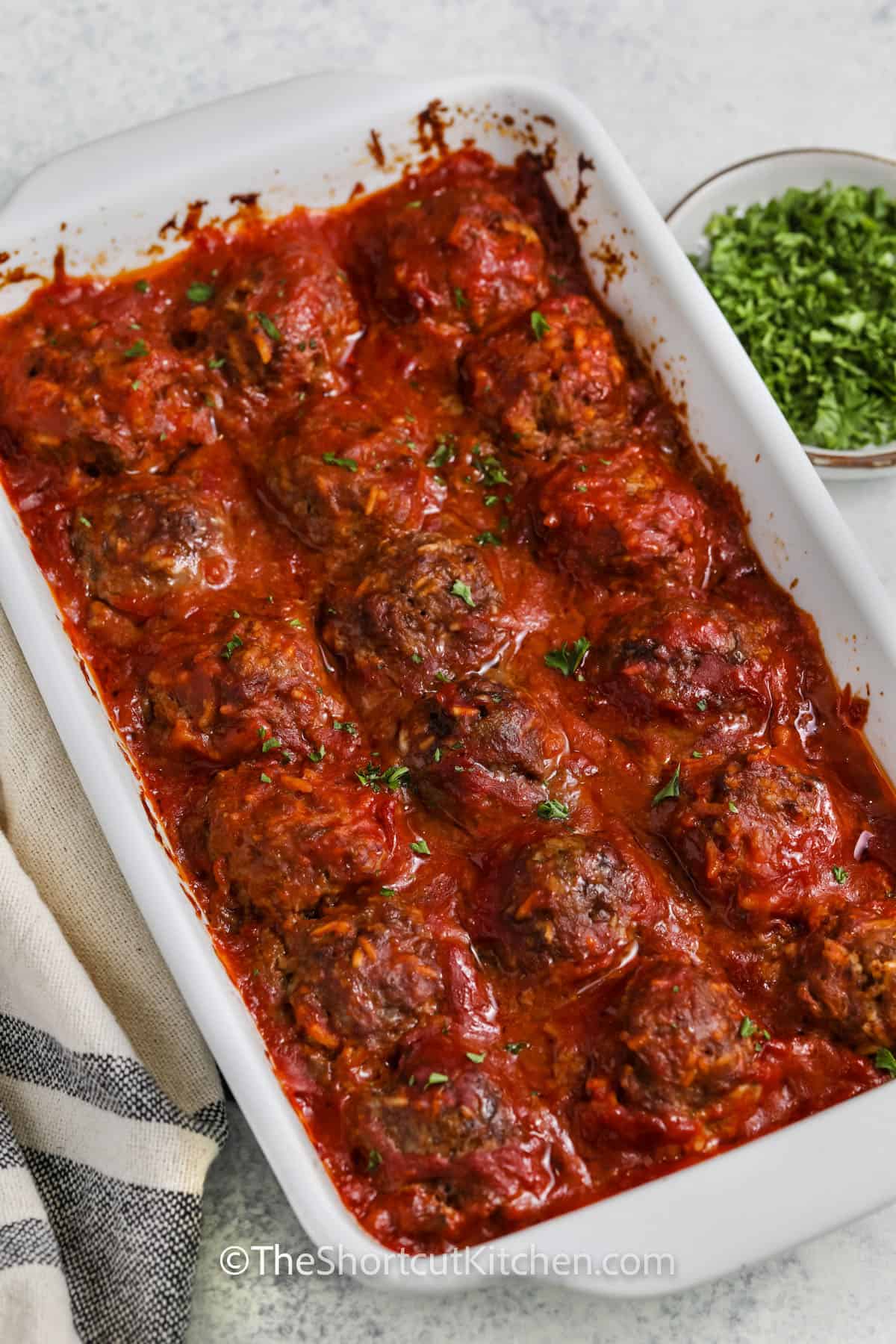 casserole dish of Porcupine Meatballs Recipe with parsley