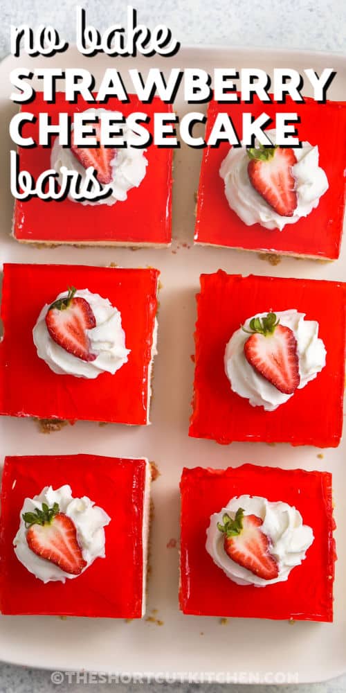 No Bake Strawberry Cheesecake Bars with strawberries on top and writing