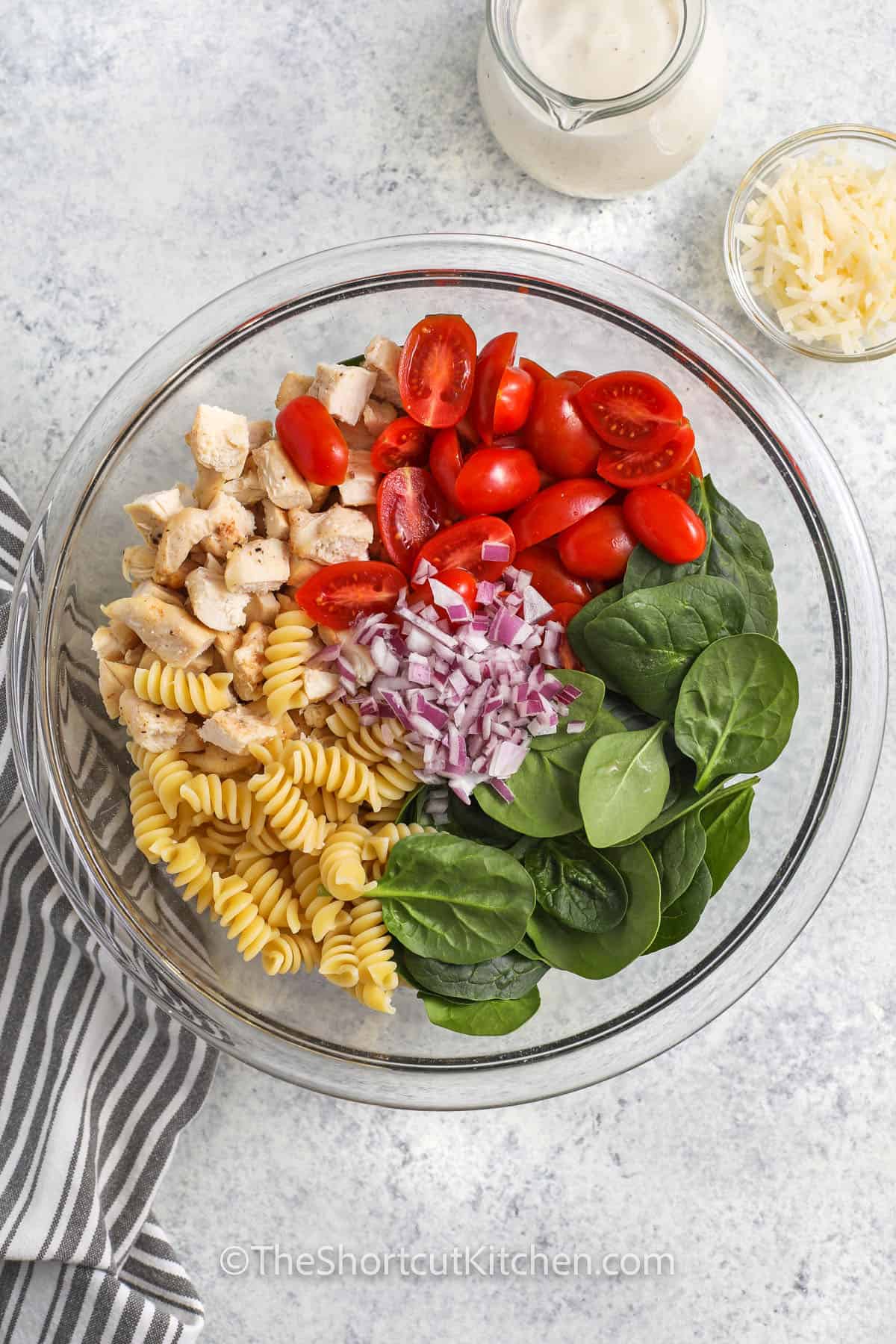 ingredients in a bowl to make Chicken Pasta Salad