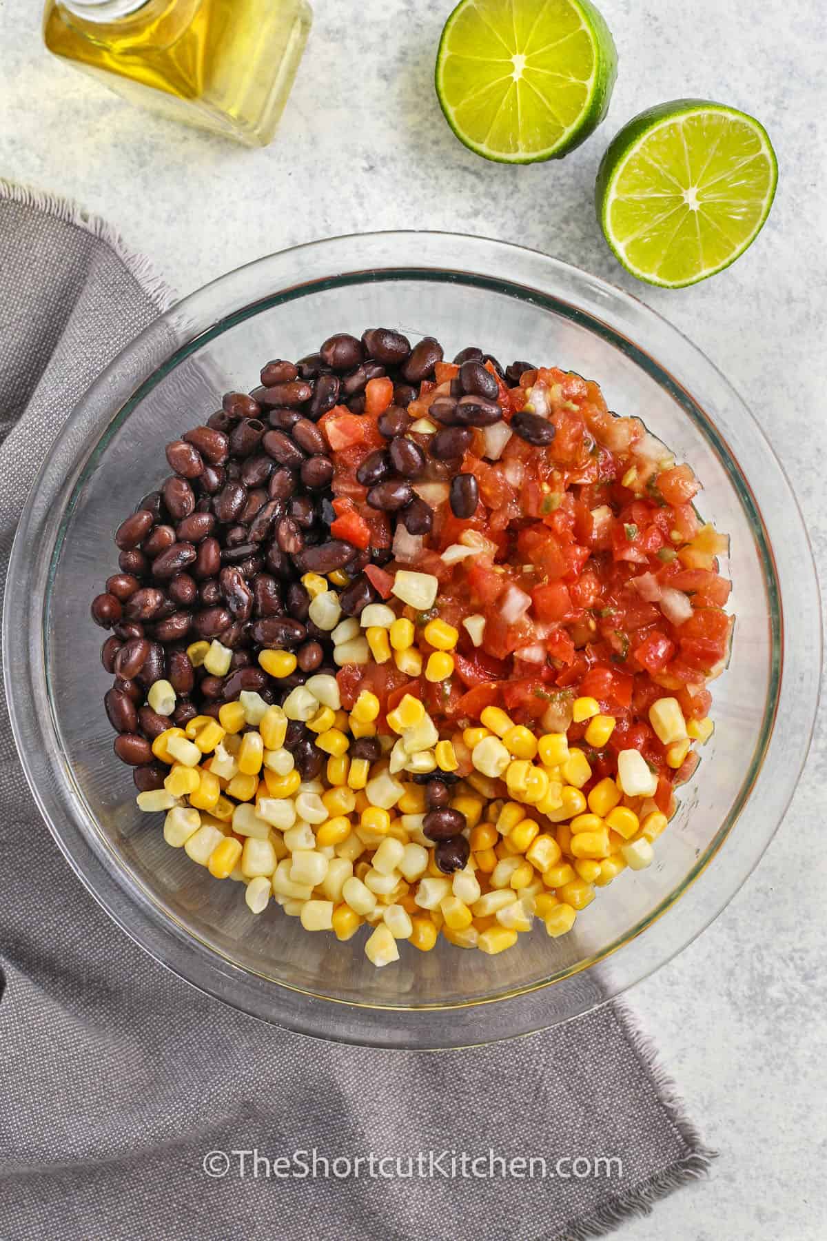 adding ingredients togethert to make Corn and Black Bean Salad