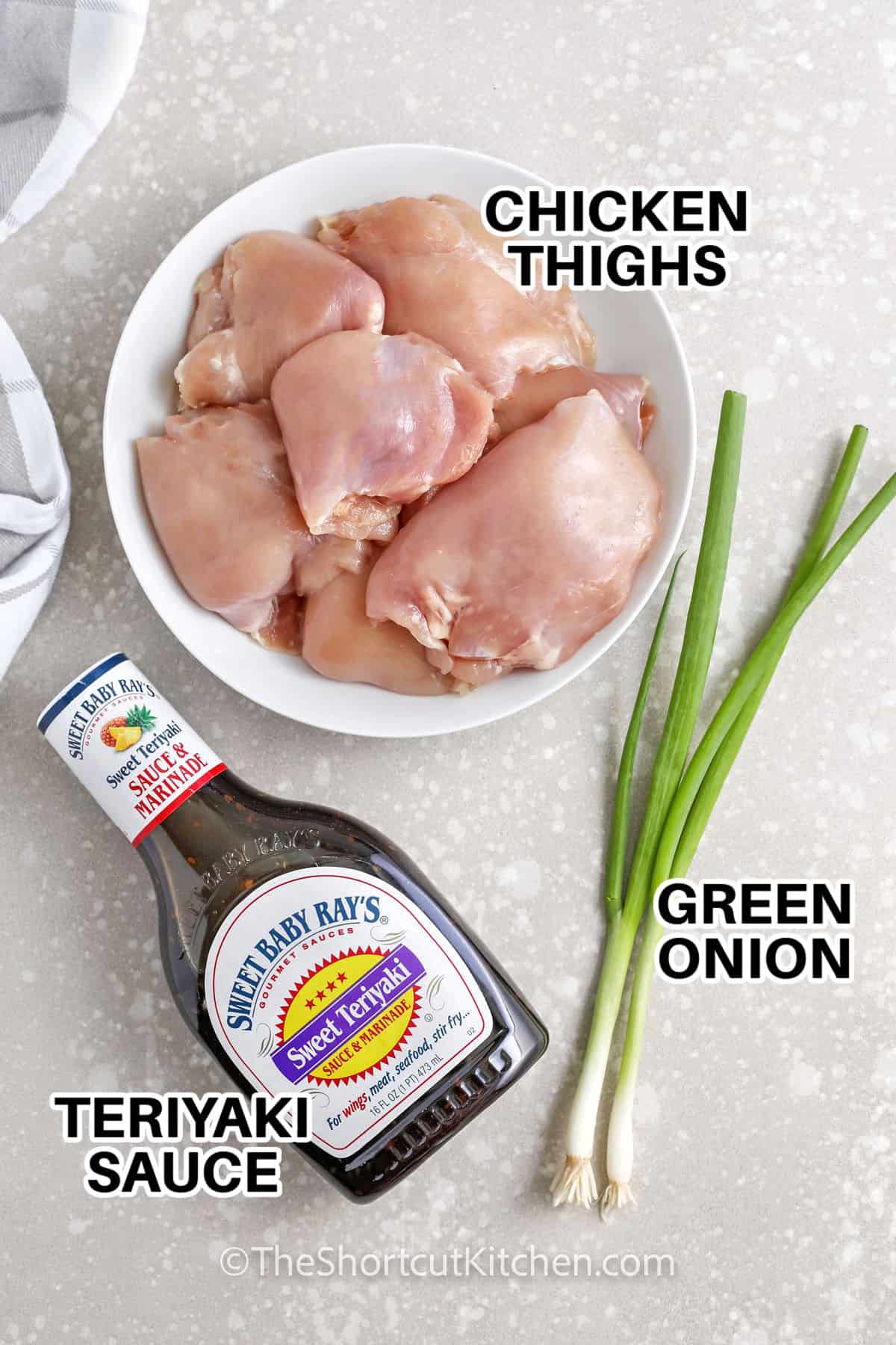 chicken thighs , teriyaki sauce and green onion with labels to make Grilled Teriyaki Chicken