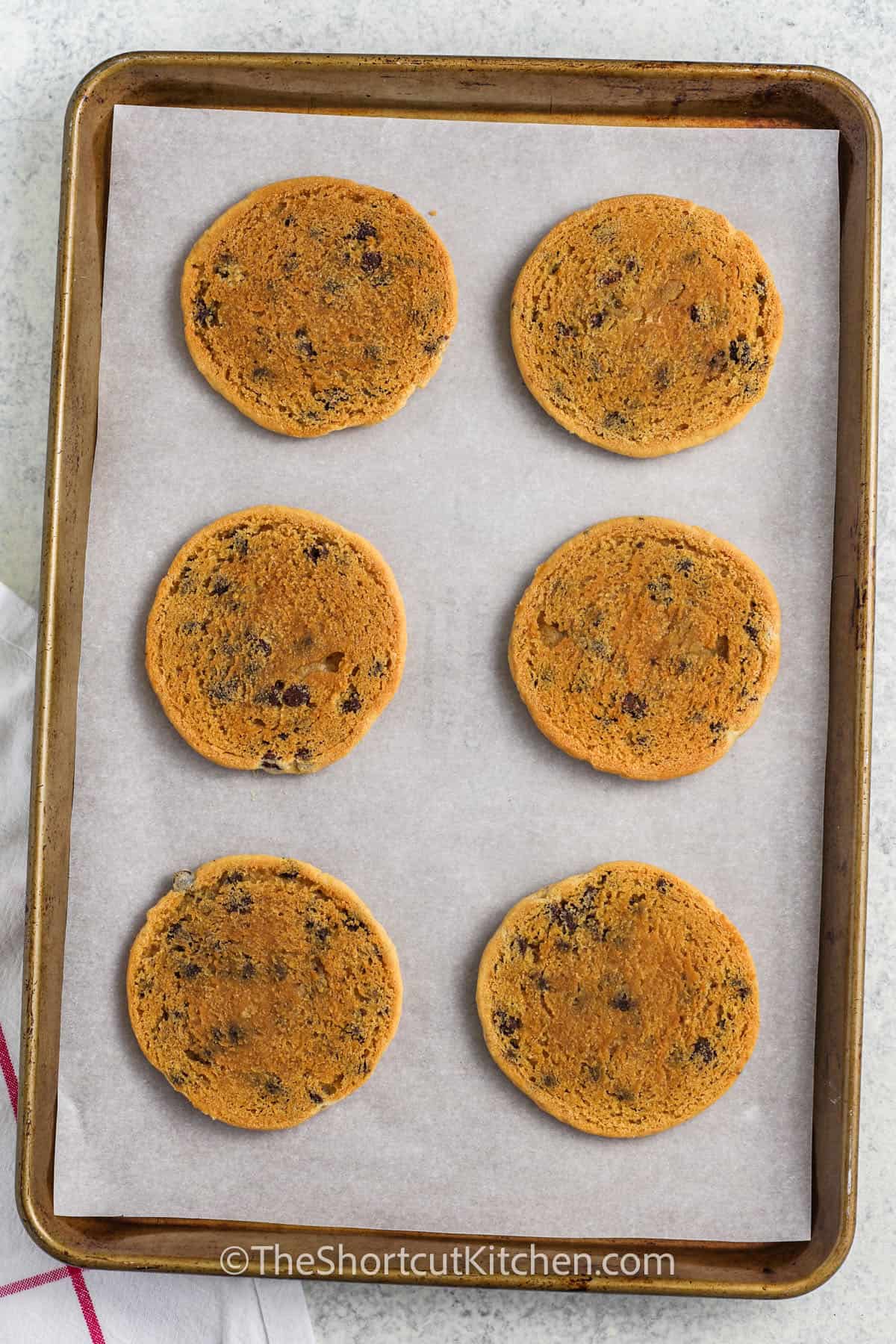 cooked cookies upside down on a pan