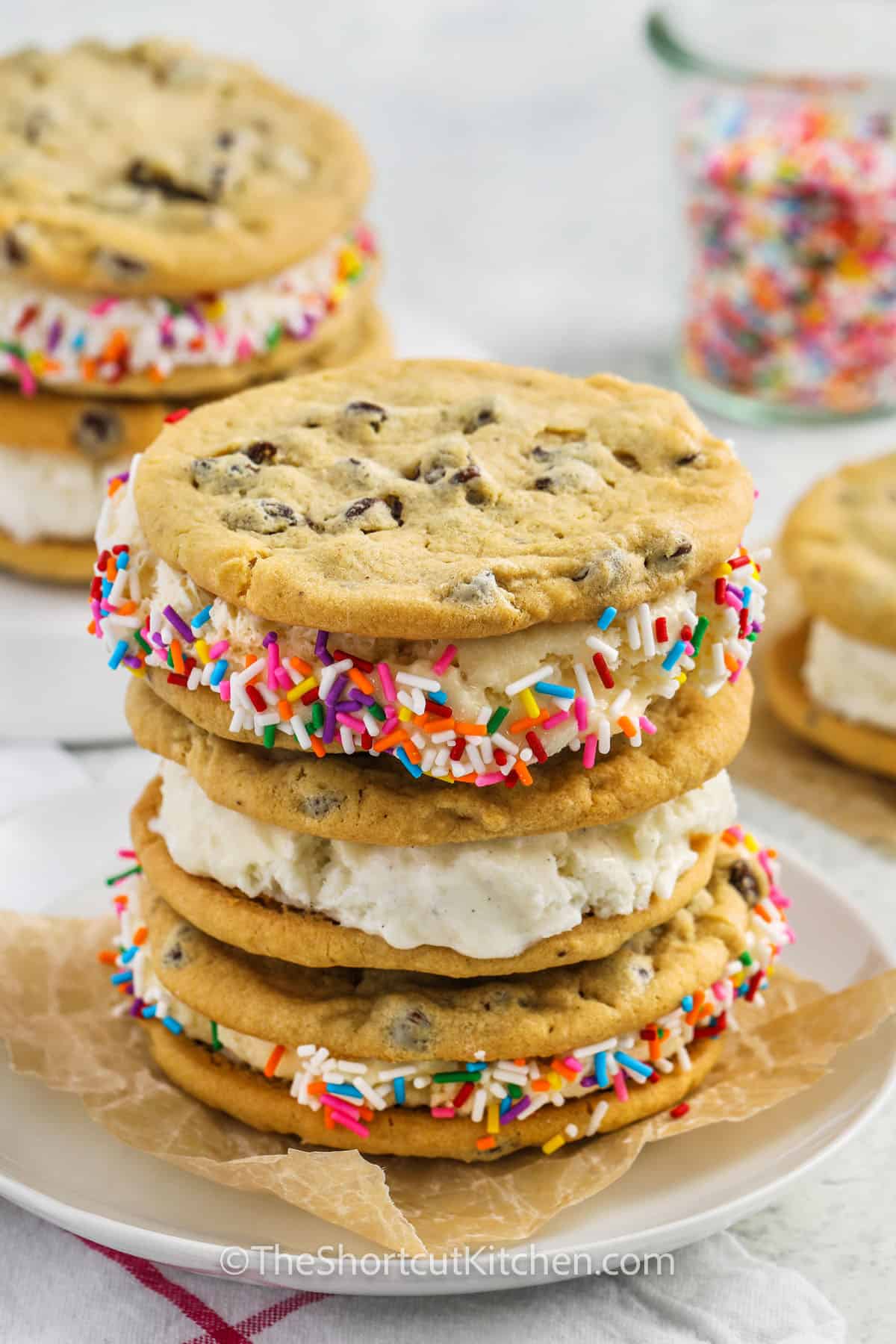 ice cream cookie sandwiches decorated with sprinkles