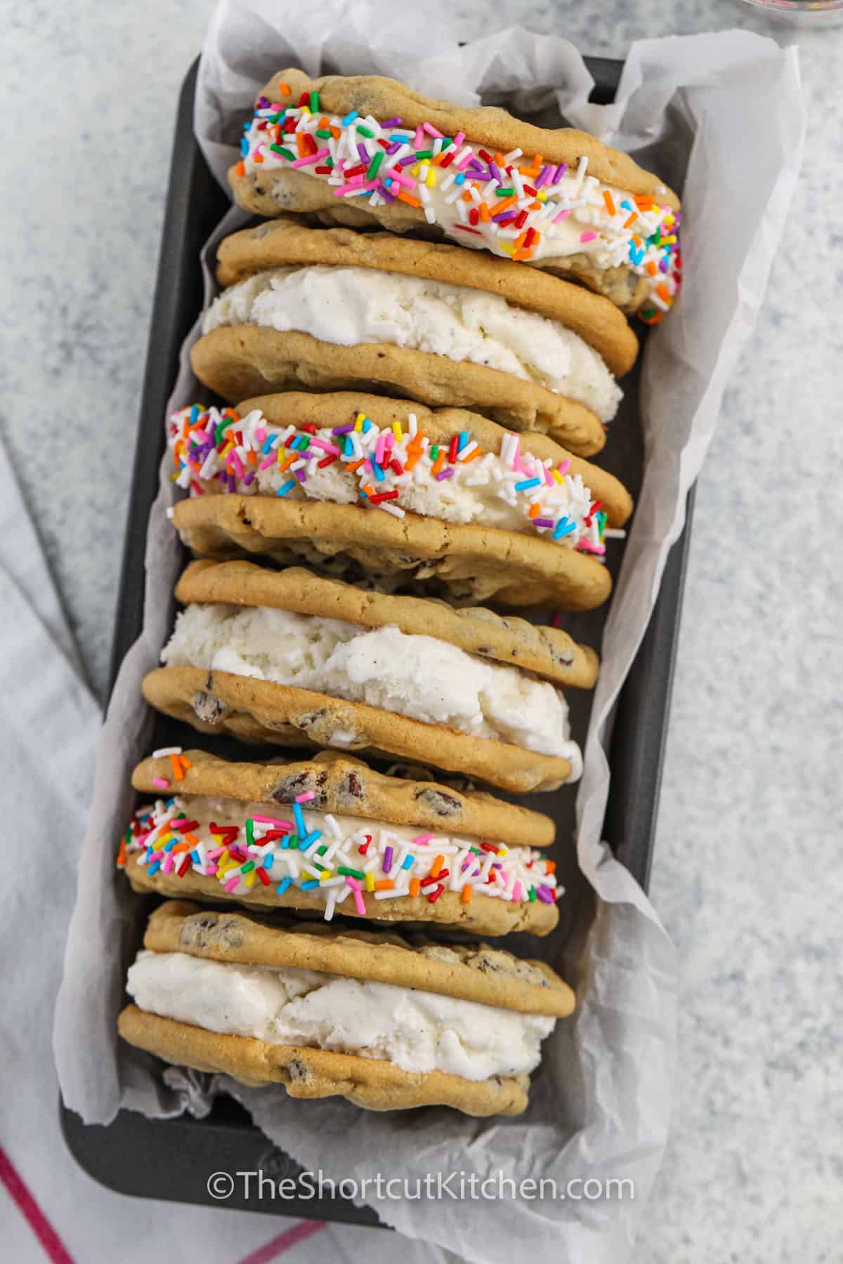 ice cream cookie sandwiches arranged in a dish