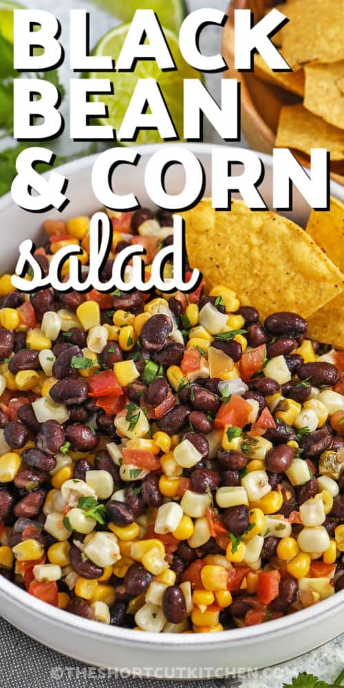 Corn and Black Bean Salad with tortilla chips and writing