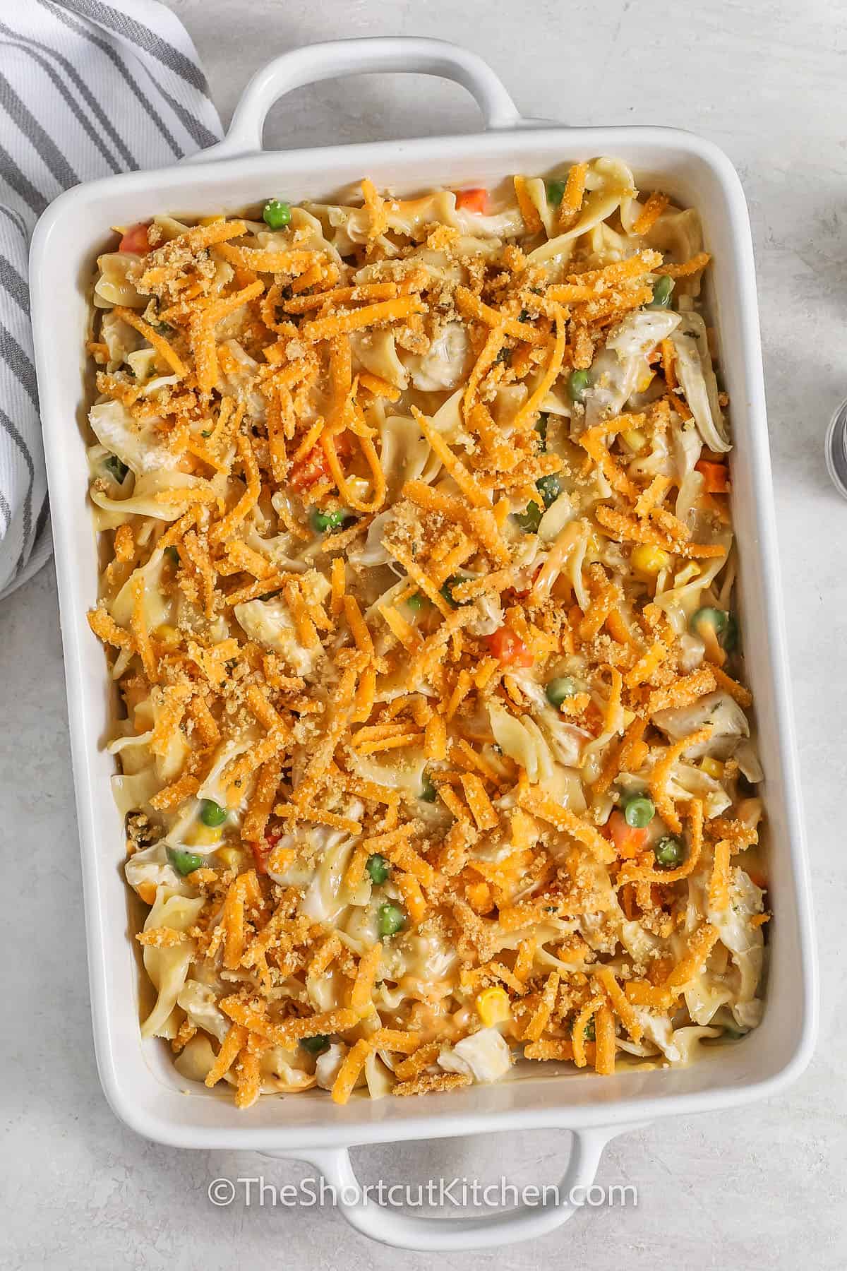 Chicken and noodle casserole assembled in a casserole dish
