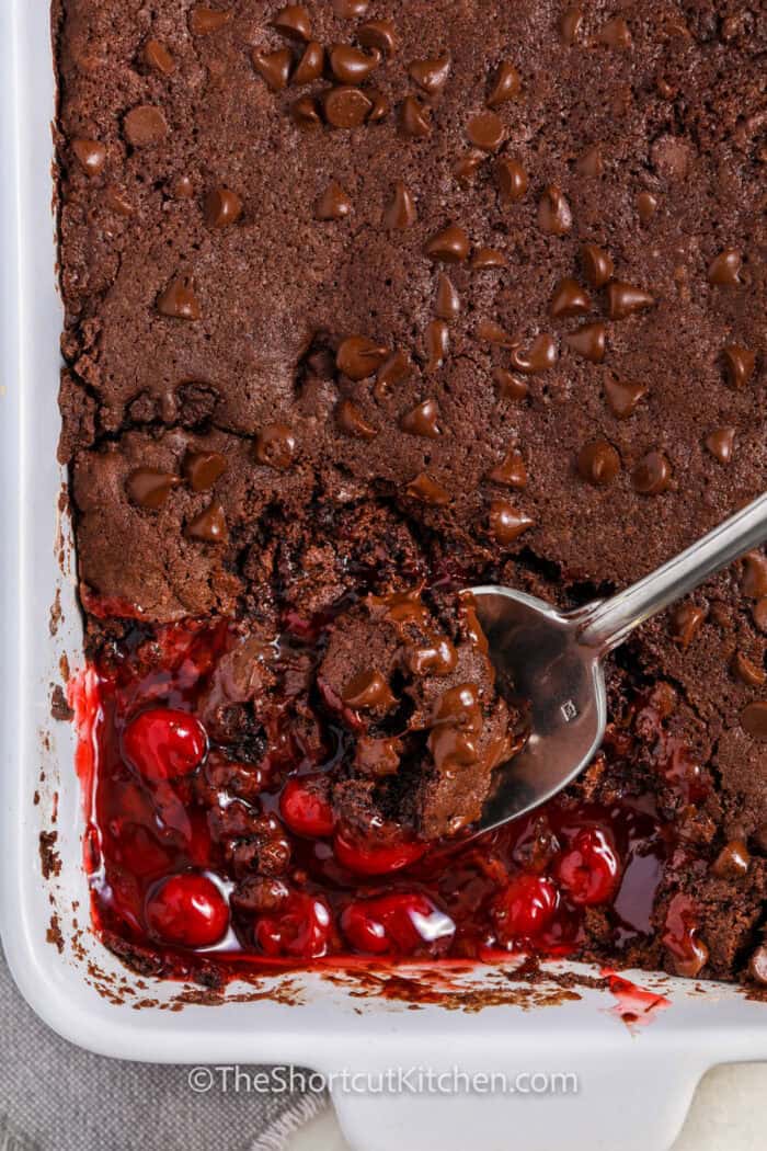dish of Chocolate Cherry Dump Cake with a spoon