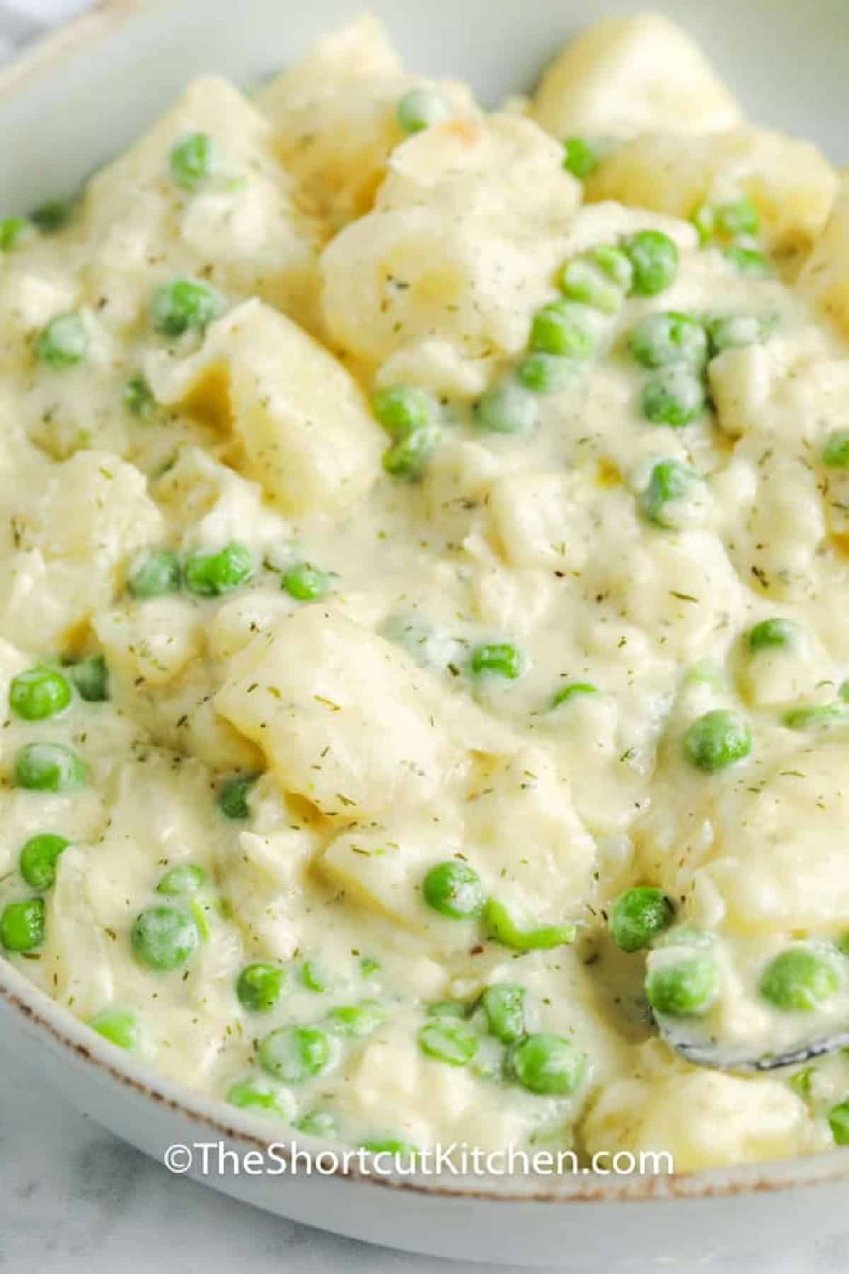 close up of Creamy Potatoes and Peas in a bowl