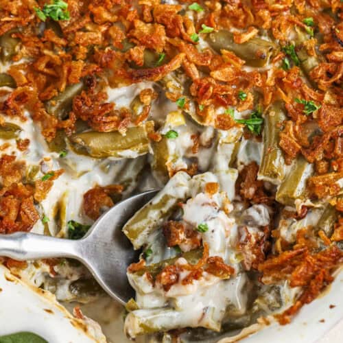 cropped spoon scooping canned green bean casserole