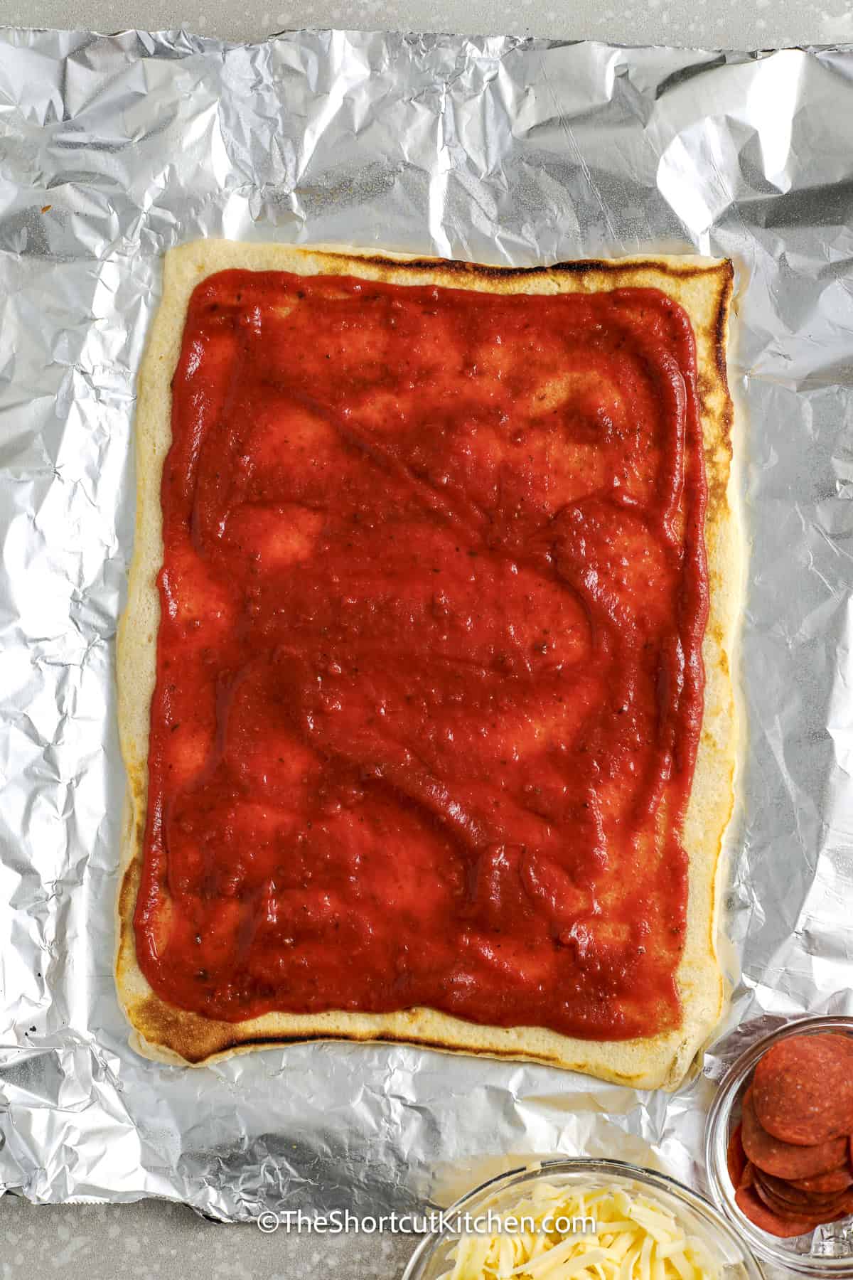 cooked grilled pizza with sauce