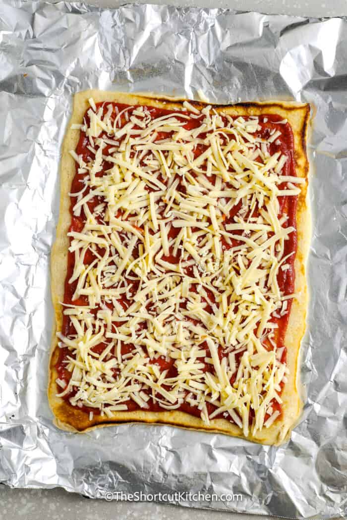 cooked grilled pizza with sauce and cheese
