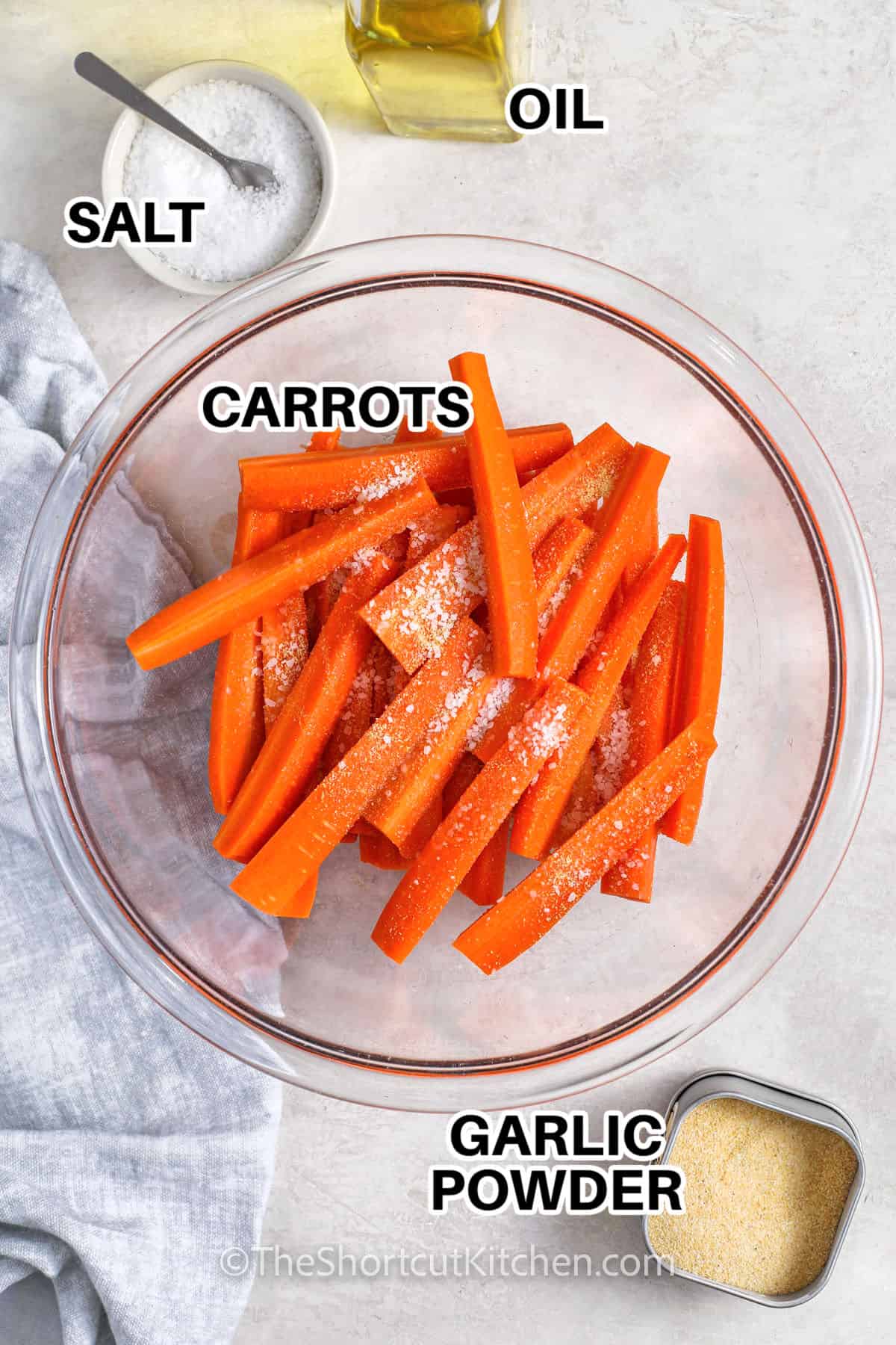 carrots , oil , salt and garlic powder with labels to make Carrot Fries