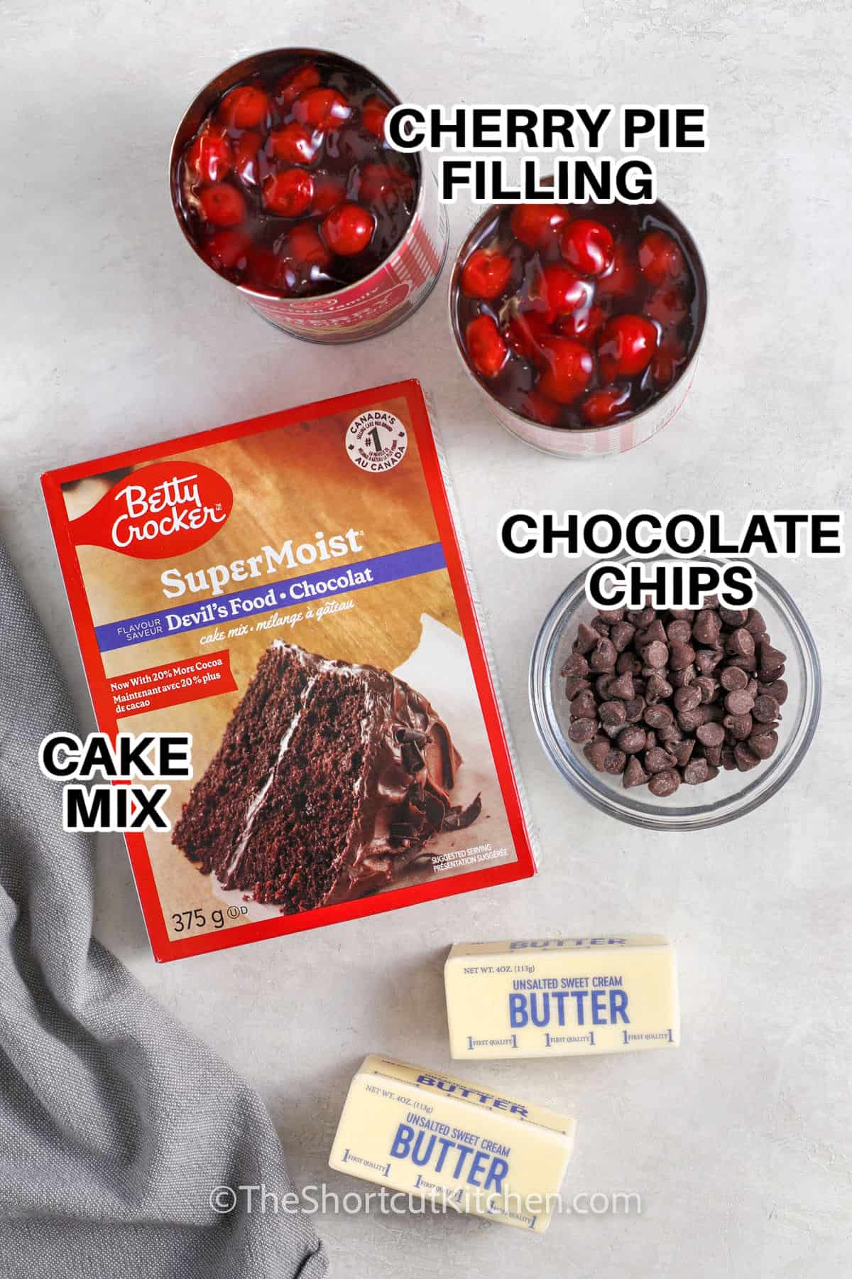 cherry pie filling , chocolate chips , cake mix and butter to make Chocolate Cherry Dump Cake with labels