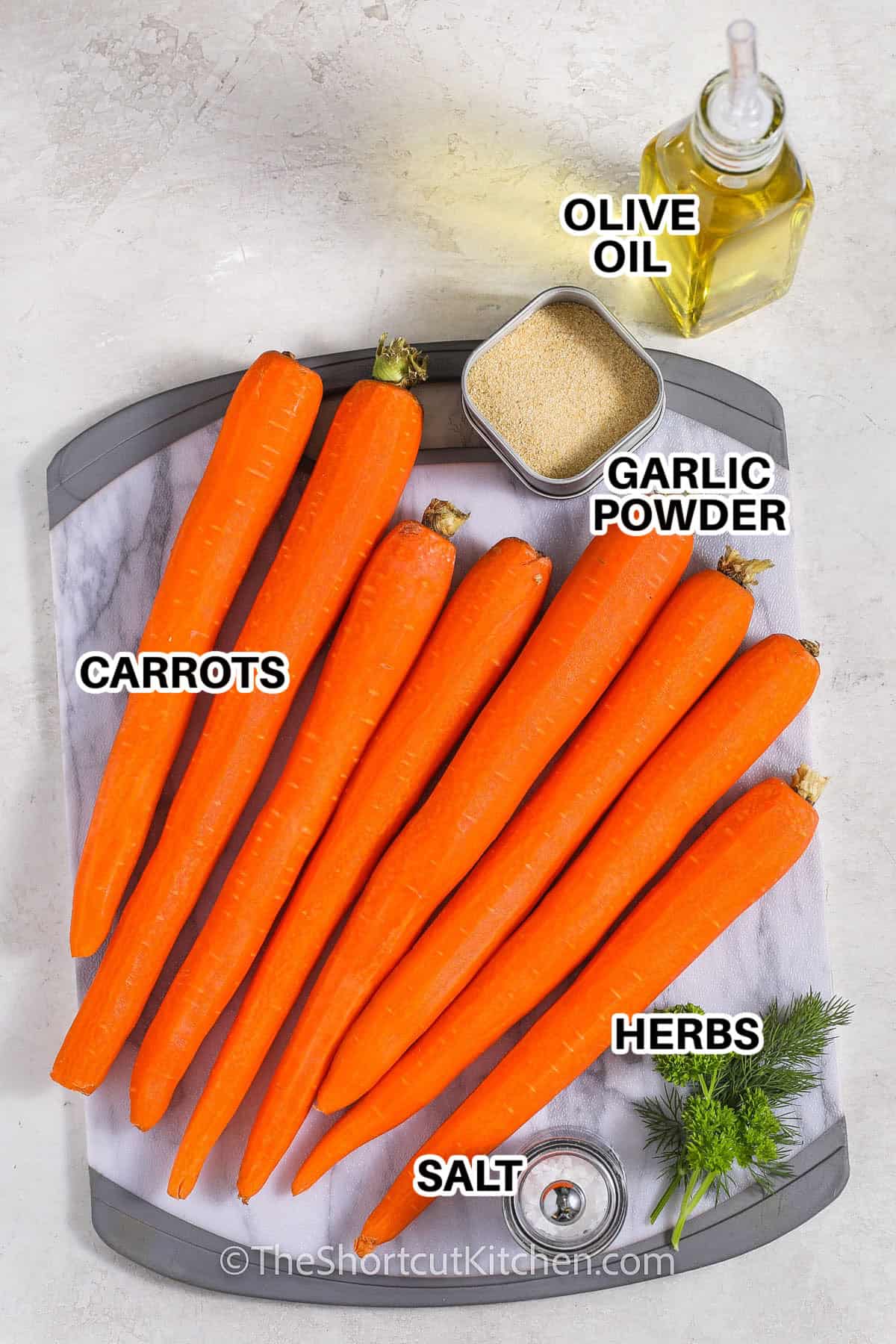 ingredients to make grilled carrots labeled: olive oil, garlic powder, carrots, herbs, and salt