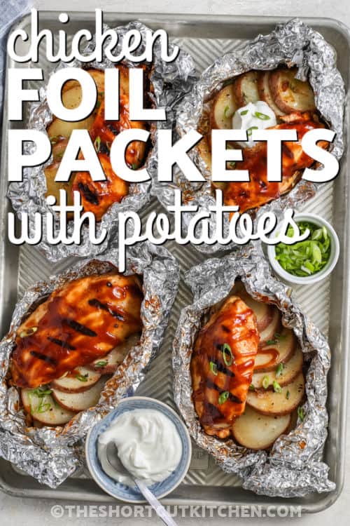sheet pan of cooked Chicken Foil Packets with writing