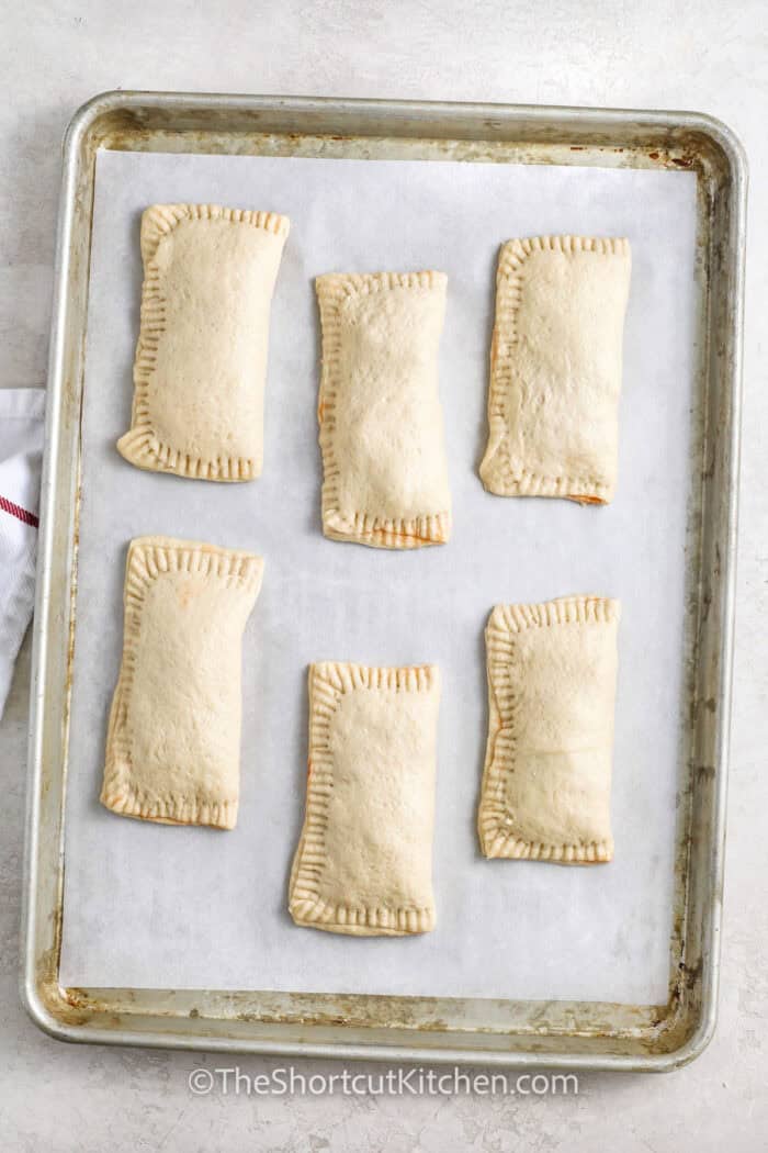 Pizza Pockets on sheet pan before cooking