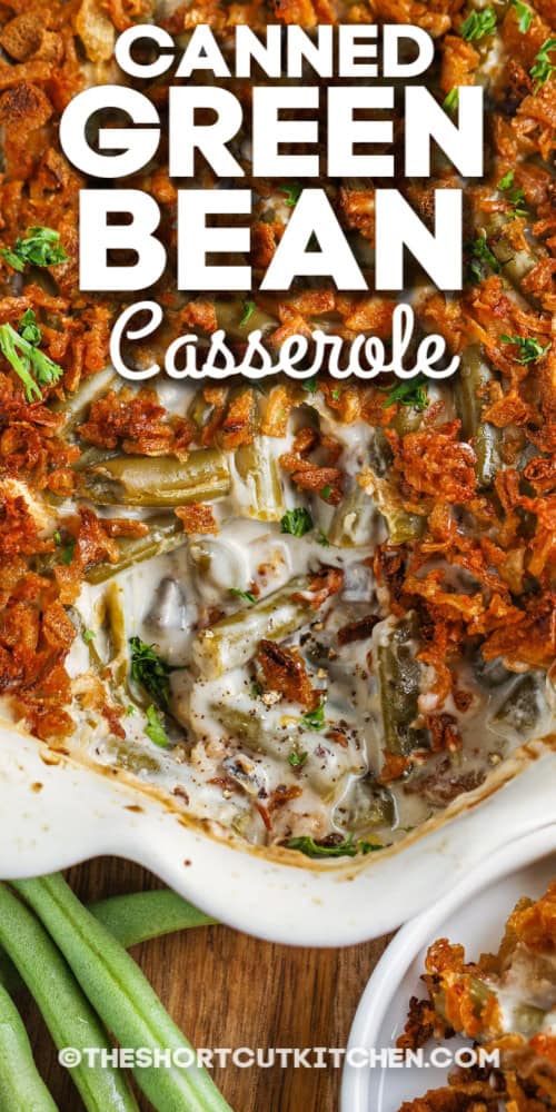 This canned green bean casserole is a comfort classic, and a favorite on holiday tables everywhere. Canned green beans are combined with cream of mushroom soup and topped with crispy fried onions, then baked until bubbly. It’s the perfect side dish to serve along with turkey, ham, or any holiday feast. Made with all packaged ingredients, green bean casserole with cream of mushroom soup is easy to prepare in minutes, and always delicious. #theshortcutkitchen canned green bean casserole in a dish with text