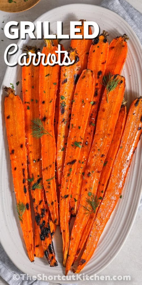 grilled carrots on a serving plate with a title