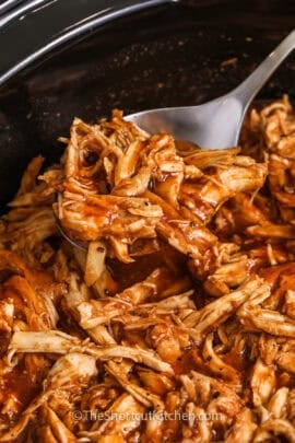 taking a spoonfull of Crockpot Pulled Chicken