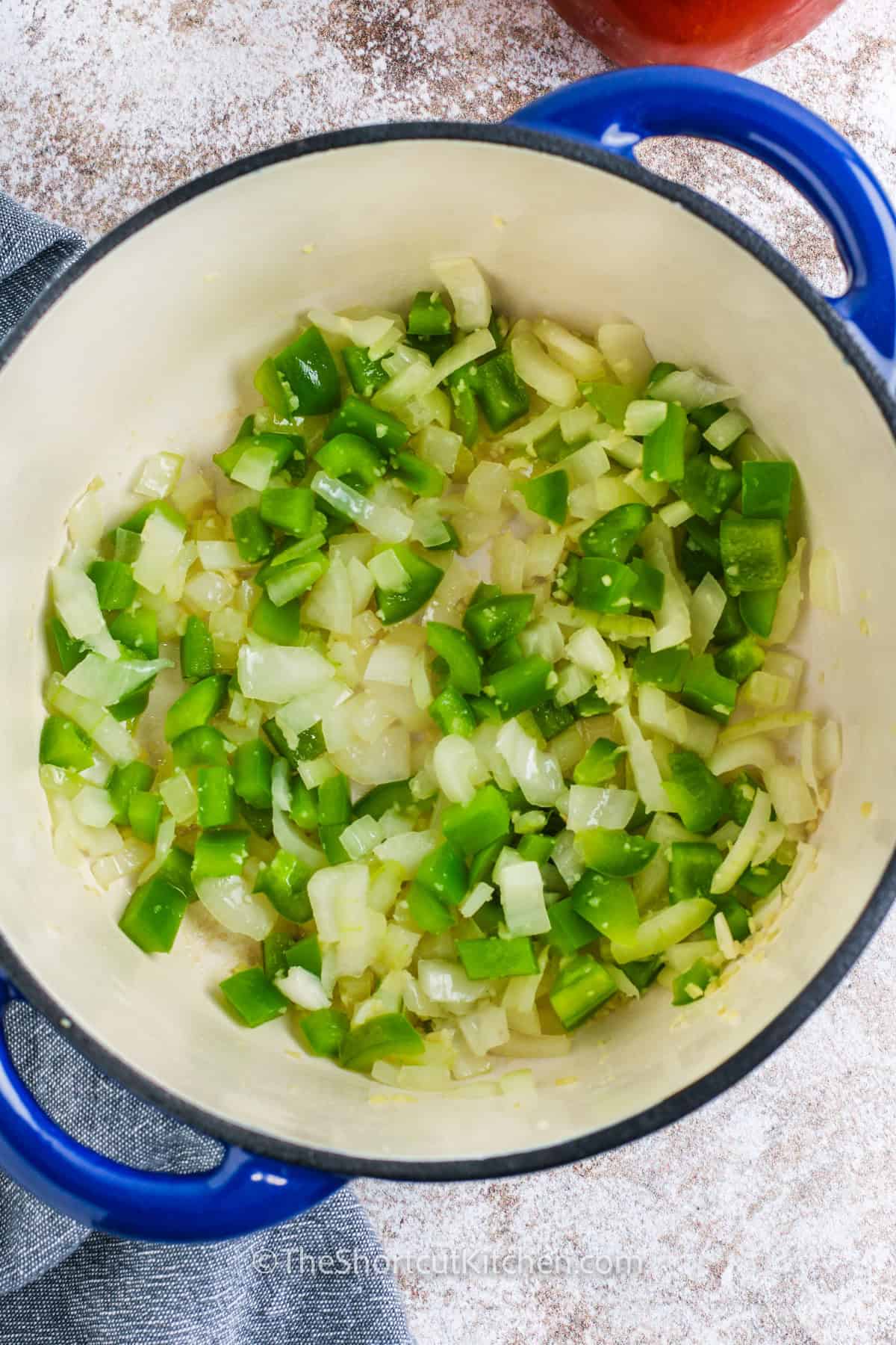 Cozy, hearty, and simple, hamburger macaroni soup is a one-pot dinner that tastes like classic comfort food. Ground beef and veggies build flavor fast, then condensed tomato soup and diced tomatoes make the broth rich and tomatoey. Stir in elbow pasta and simmer until al dente. This beef tomato macaroni soup is perfect for feeding a crowd and planning leftovers. #theshortcutkitchen vegetables in a pot