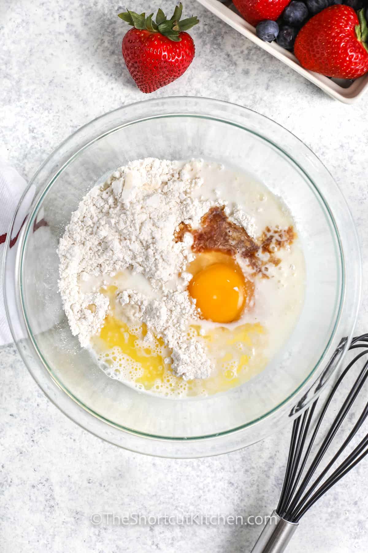 adding wet and dry ingredients together to make Pancake Tacos