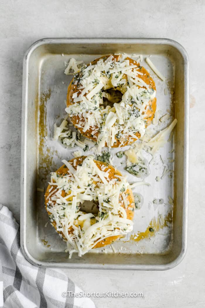 bagels topped with cheese and spread