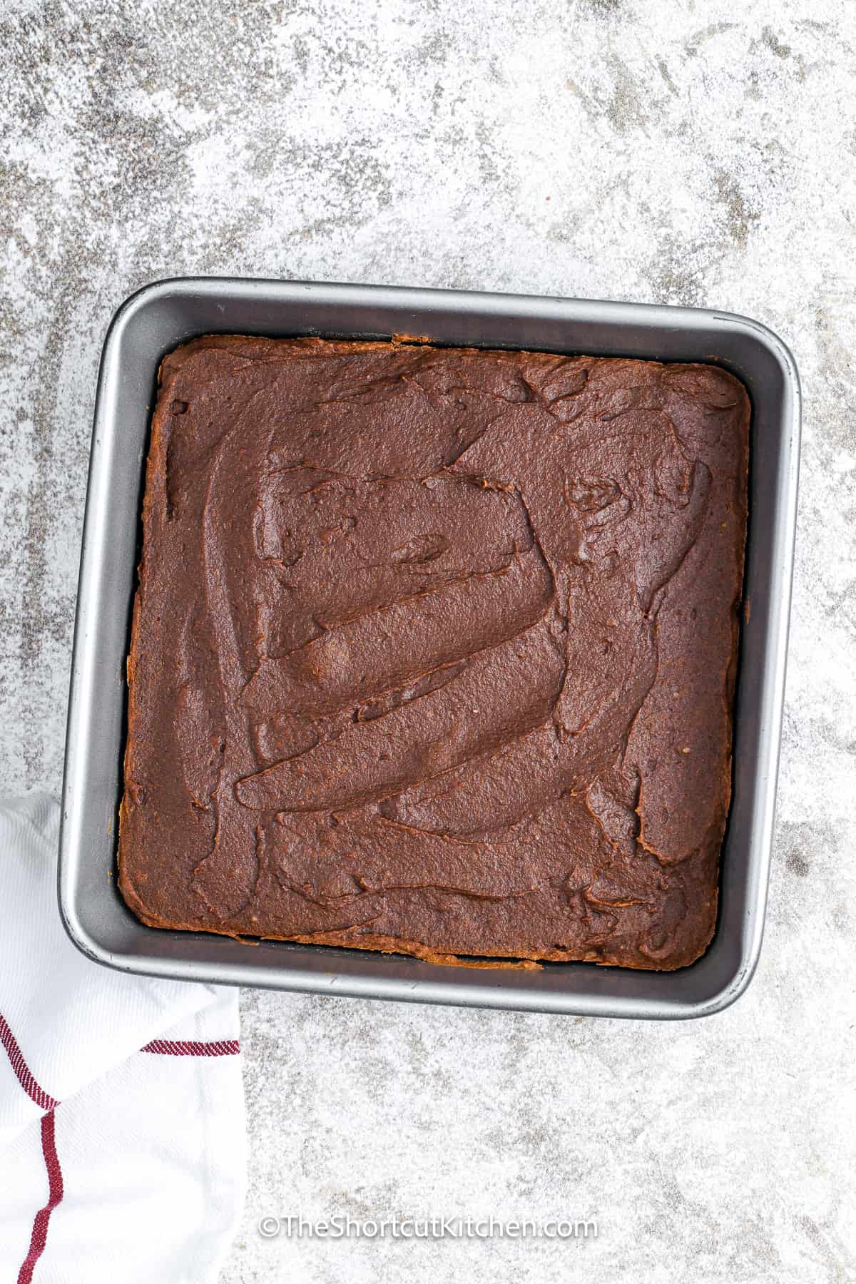 Iced Pumpkin brownies in a baking dish