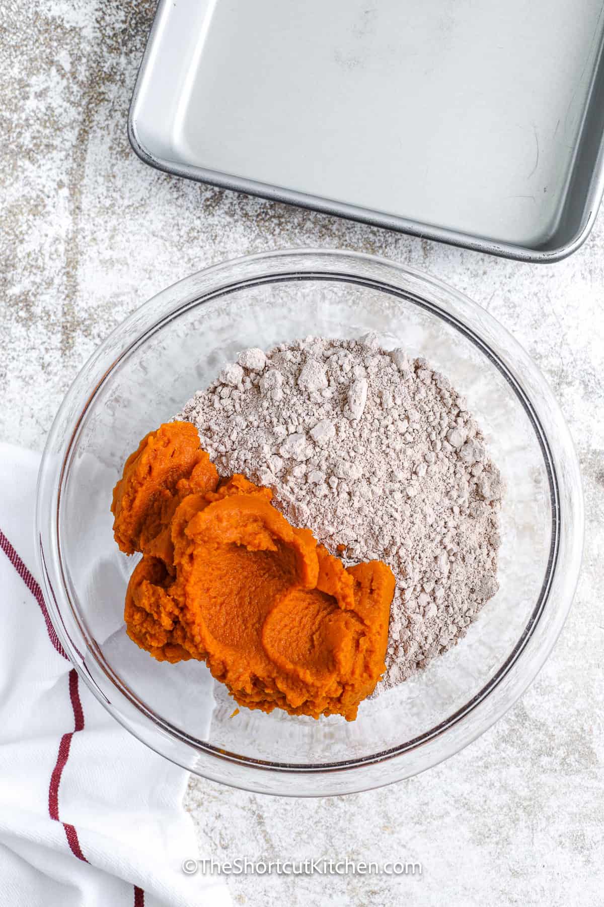 Ingredients to make Pumpkin Brownies being combined in a bowl