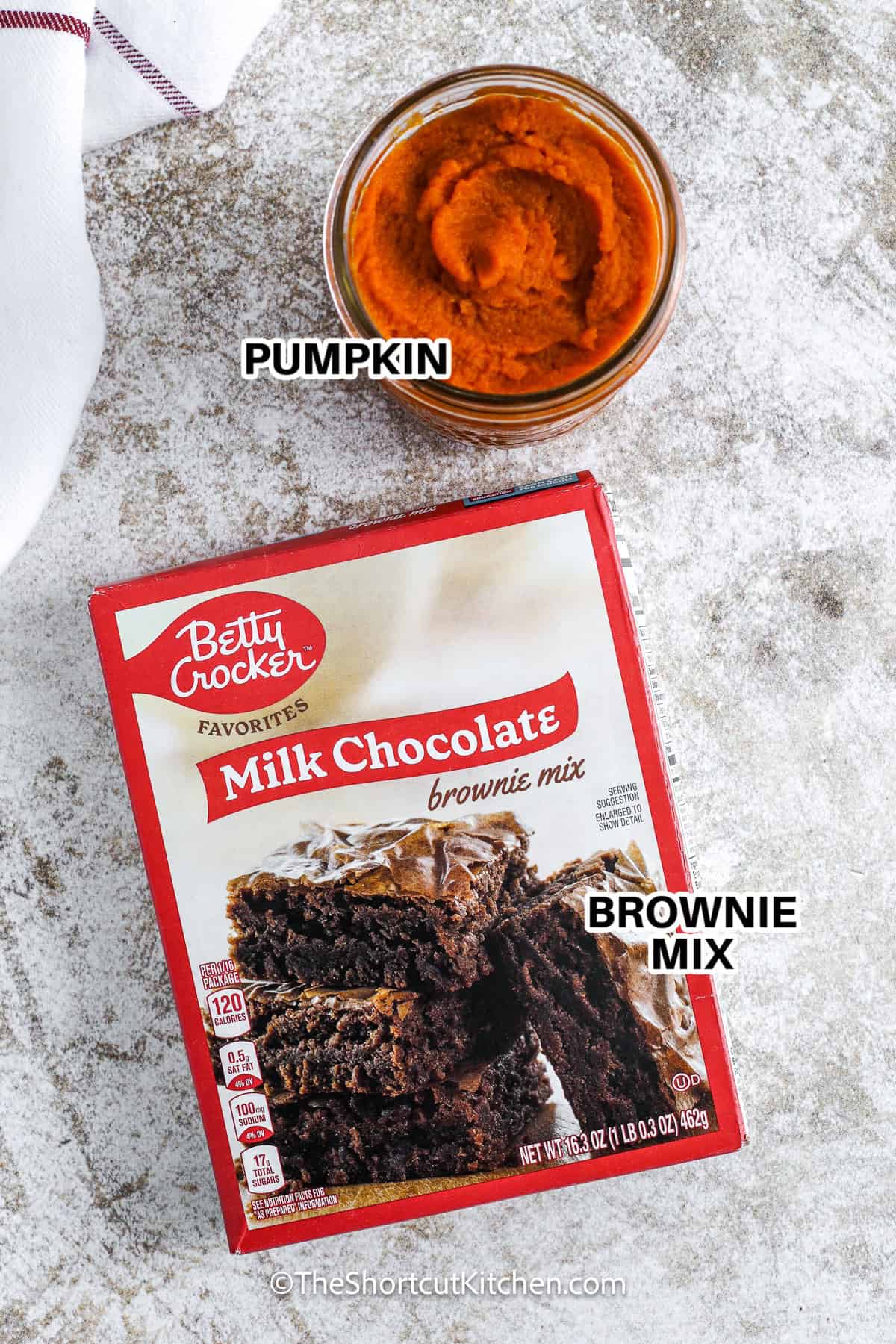 Ingredients to make Pumpkin Brownies labeled: pumpkin and brownie mix