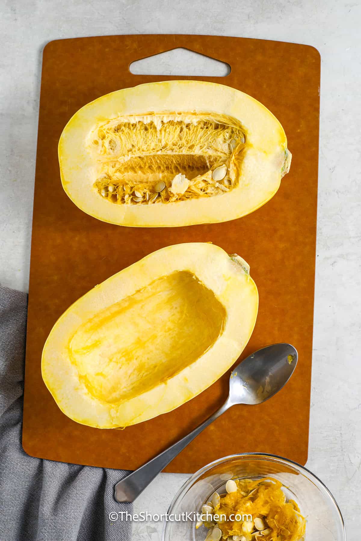 spaghetti squash sliced on a boar