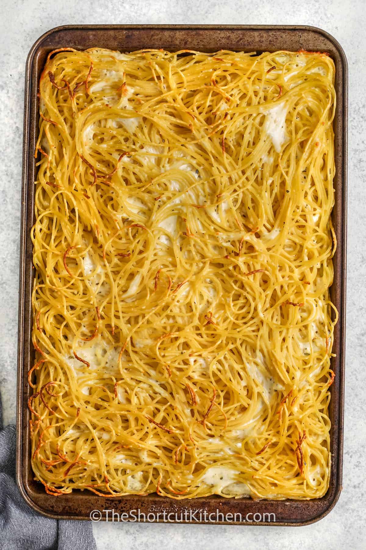 cooked spaghetti and parmesan to make Spaghetti Pizza