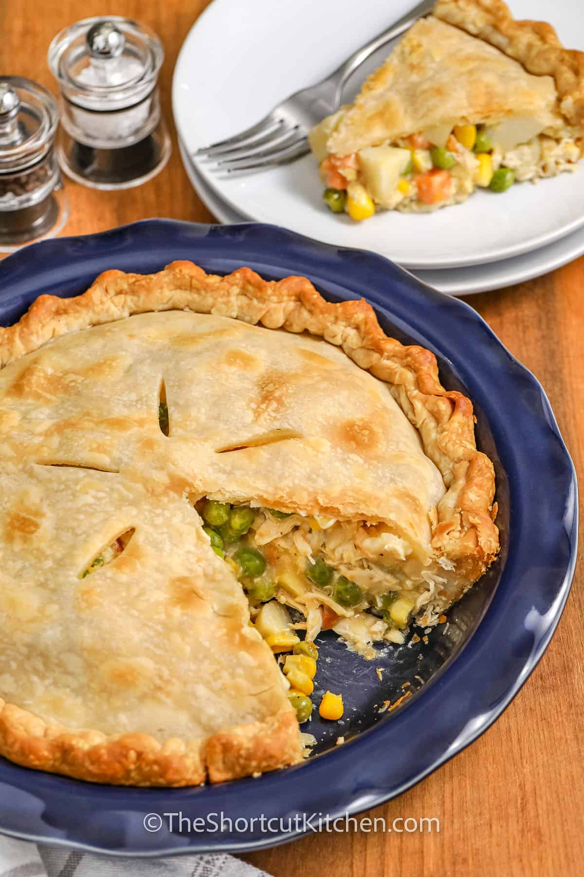 Best Chicken Pot Pie with a slice taken out on a plate