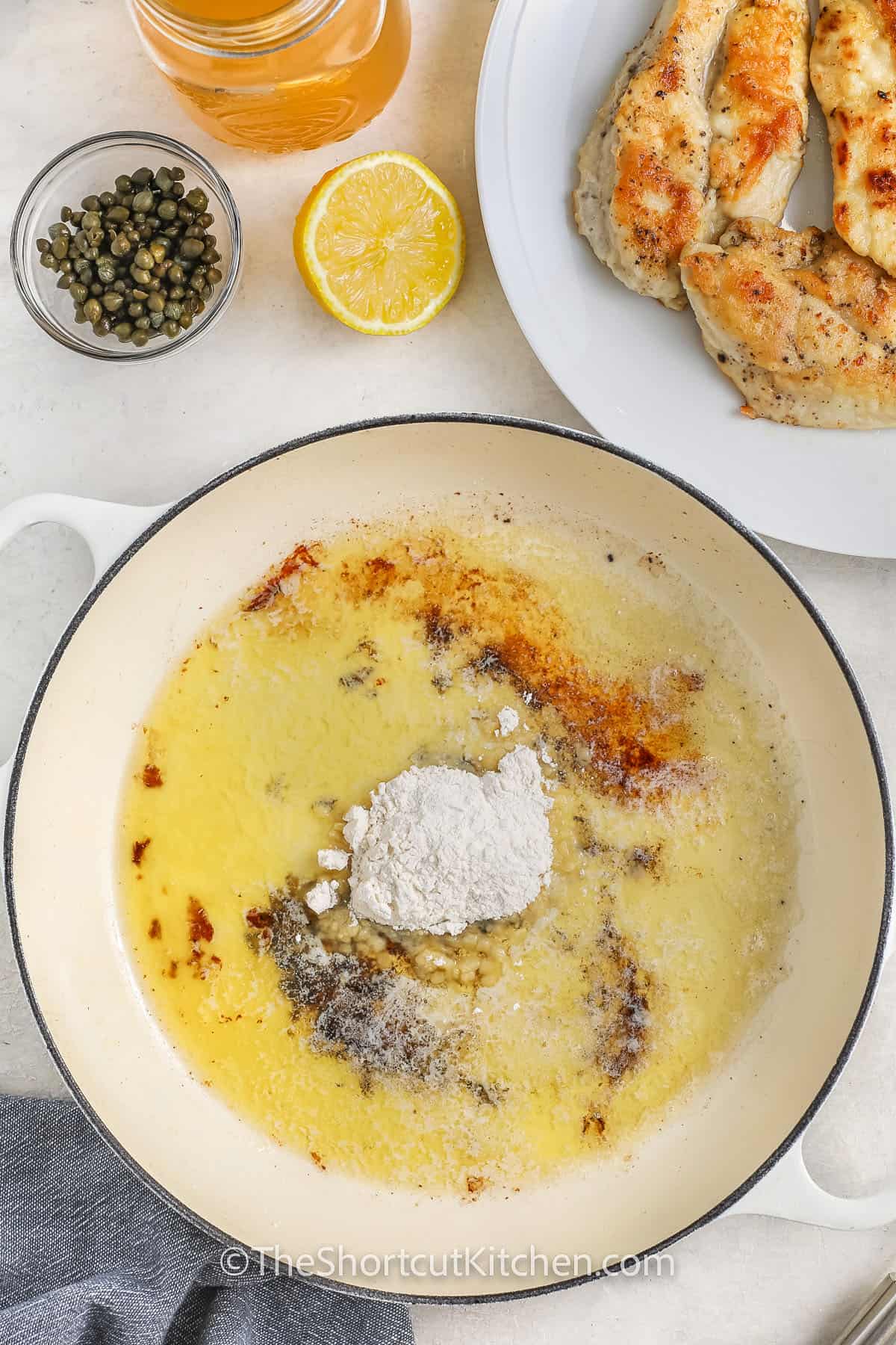 adding flour to butter to make Chicken Scallopini Recipe