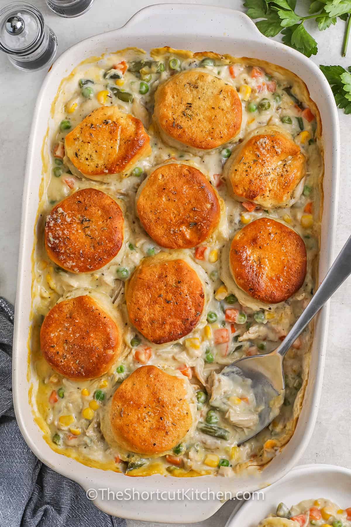 Easy Chicken Pot Pie Casserole in a casserole dish with a spoon