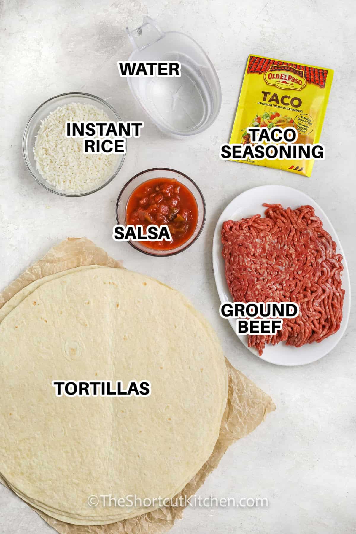 ingredients to make taco burritos labeled: water, instant rice, taco seasoning, salsa, ground beef, and tortillas