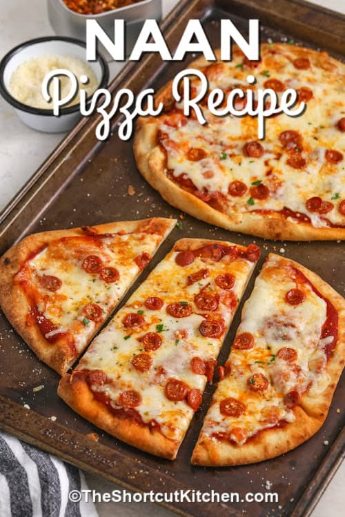 Baked naan pizzas on a baking tray with a title