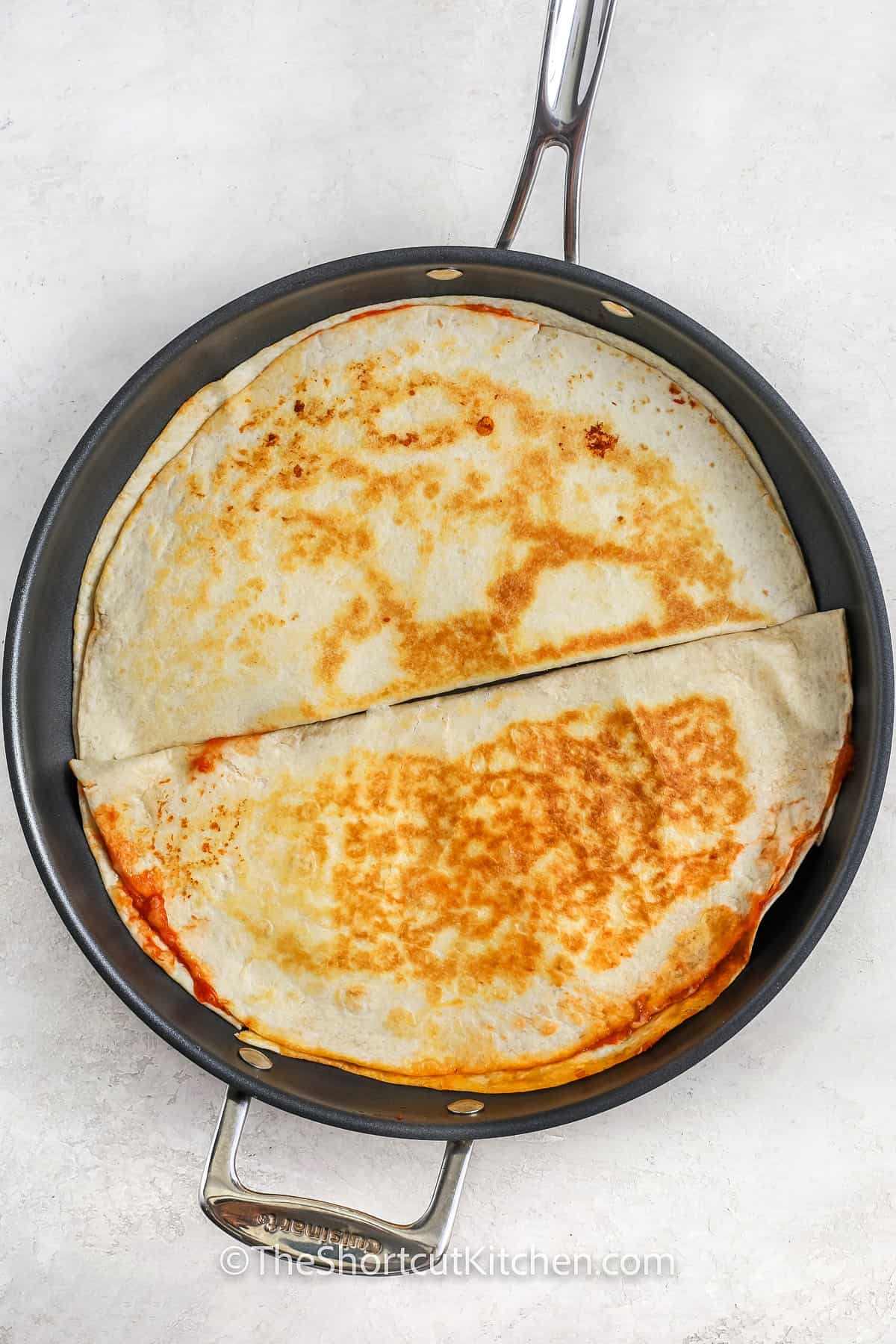 frying Pizza Quesadilla in a pan