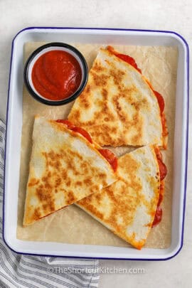 Pizza Quesadilla on a plate with marinara