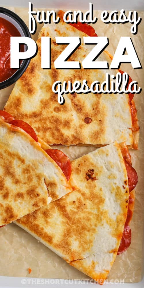 slices of Pizza Quesadilla with marinara with writing