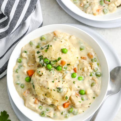 a bowl of chicken and dumplings ready to be served