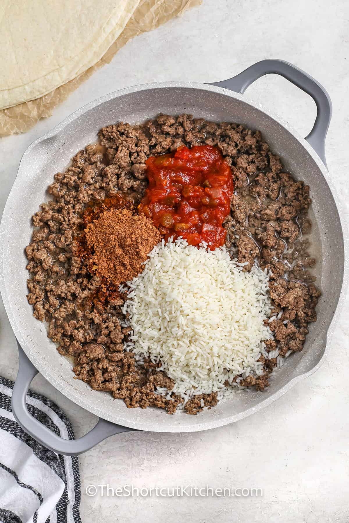 ingredients to make taco burrito filling in a sauce pan