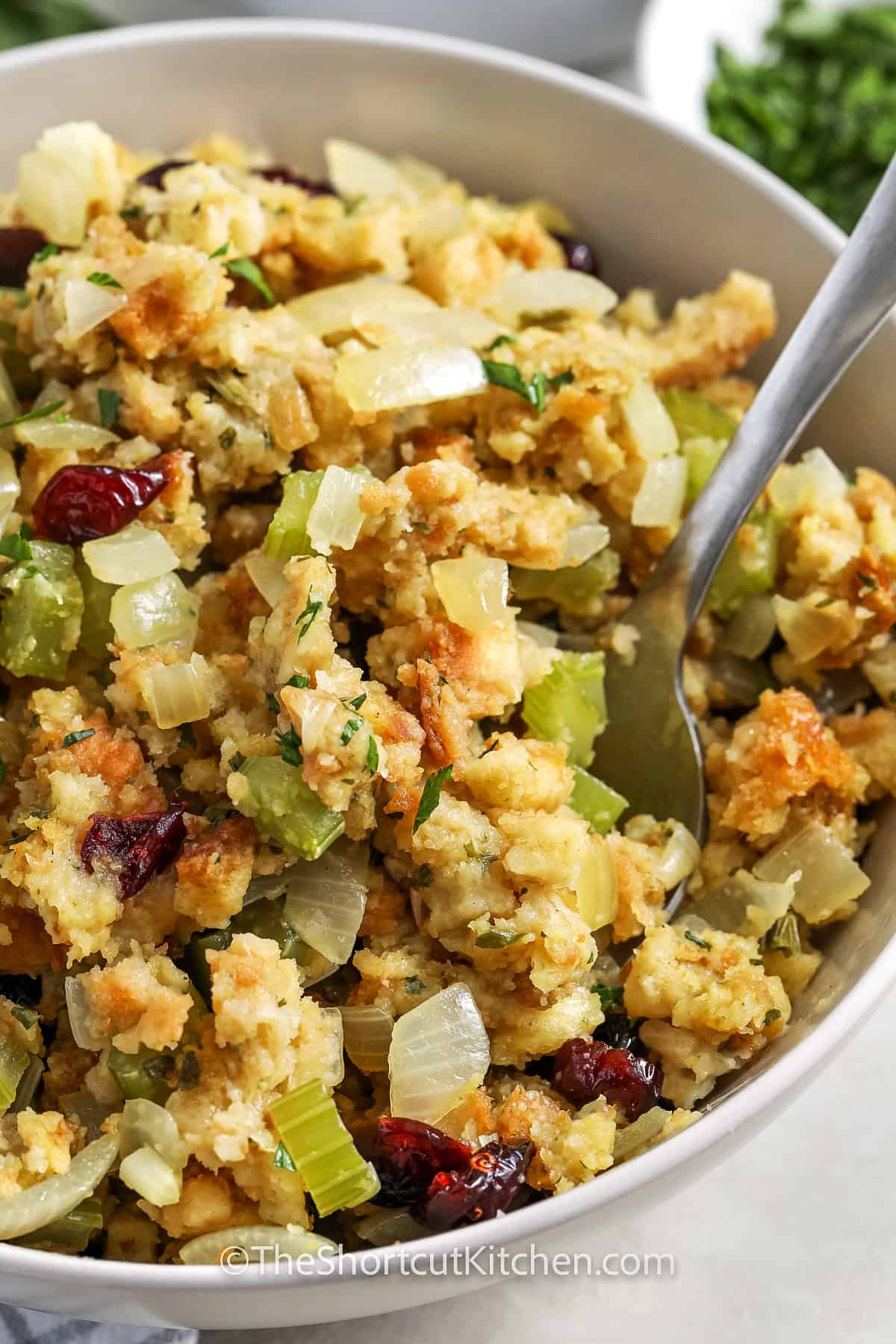 thanksgiving stuffing and spoon in a bowl