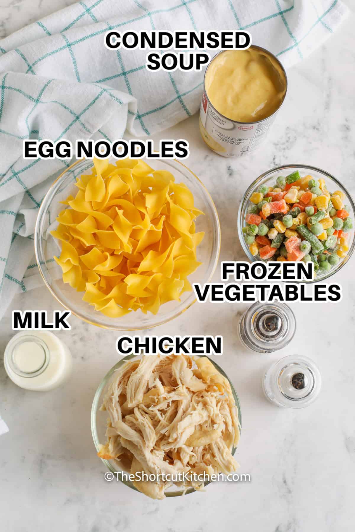 Ingredients for Chicken and Egg Noodles including egg noodles, condensed soup, frozen vegetables, milk, and chicken